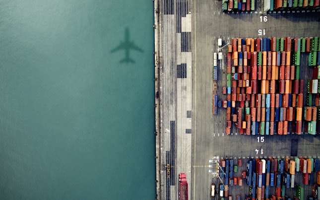 Shadow of Plane over Container Port